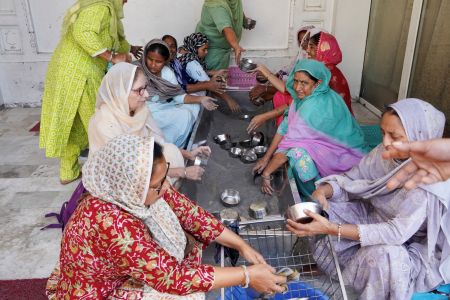 Women volunteers washing utensils at the Golden Temple langar.