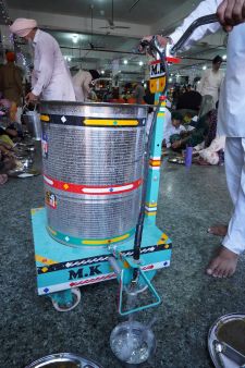 Automatic water dispenser at Golden Temple langar, serving thousands efficiently.