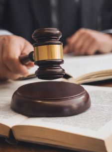 Gavel on law book representing legal authority