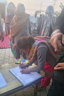 Villagers signing the Gram Sabha resolution register at Sekhonwal demanding return of Panchayat land and action over crop destruction