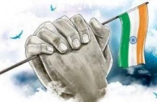 Hand holding the Indian national flag symbolically