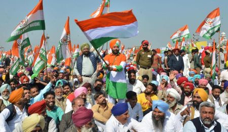 Punjab Congress supporters at a political rally with party flags
