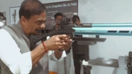 Assam Chief Minister Hemanta Biswa Sarma holding a firearm in a viral video clip.