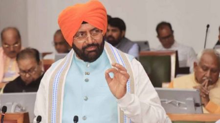 Haryana Chief Minister Nayab Singh Saini presenting the 2026–27 state budget wearing a saffron turban in the Vidhan Sabha